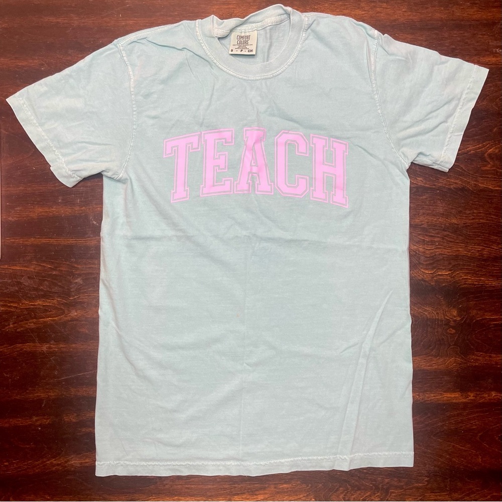 Teach T-Shirt - Light Blue Shirt with Purple Font